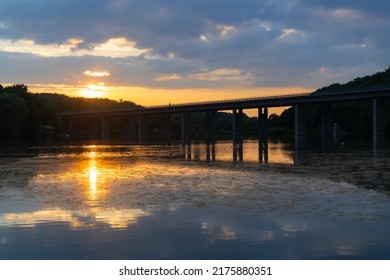 Autobahn No. 46 Concrete Bridge Spanning Over “Seilersee“ Or “Callerbach-Talsperre“ In Iserlohn Sauerland Germany. Idyllic Panorama With Bridge Silhouette Back Lit By Low Evening Sun And Warm Light.