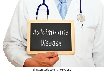 Autoimmune Disease - Doctor holding chalkboard with text on white background