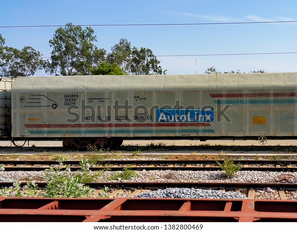Autolinx Freight Rail Service from APL Logistics\
Vascor Automotive Private Limited. The Silver coloured Train\
compartment is seen parked outside a railway station [Arakkonam,\
TN, India - May 12,\
2016]