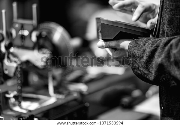 Automated Assembly line of\
mechanical engineering. Shallow depth of field. The background is\
blurred.