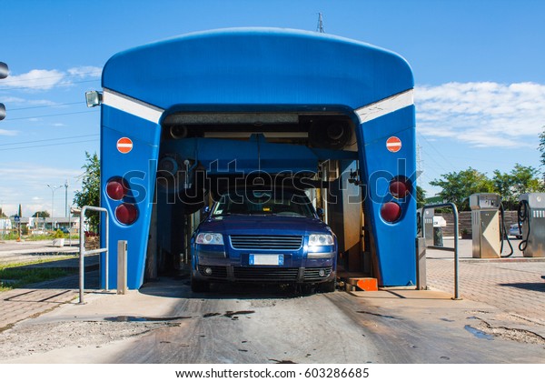 Automated\
portal carwash with a car running\
through
