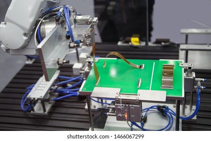 Automated Robot Connecting Flexible Flat Cable FFC On Print Circuit Board (PCB). Electronics Industry