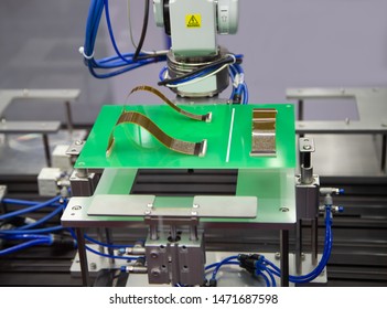 Automated Robot Connecting Flexible Flat Cable FFC On Print Circuit Board (PCB). Electronics Industry