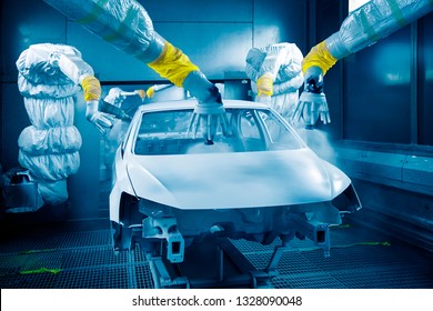 Automated robotic arm is painting on the automobile manufacturing line - Powered by Shutterstock