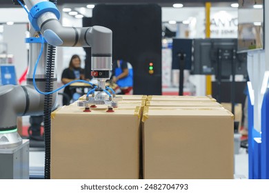 automated robotic packing system designed for industrial use, efficiently handling and packing large boxes - Powered by Shutterstock