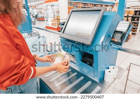 automated self-service checkout at the supermarket allows customers to quickly scan and pay for their items without the need for a cashier.