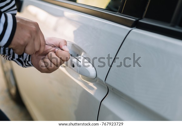 Automated theft attempts to screw the car\
with a screwdriver.