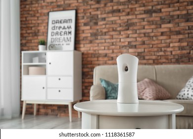 Automatic Air Freshener On Table At Home