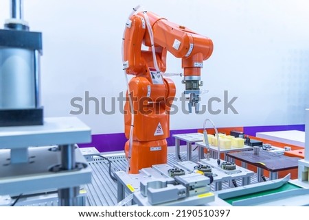 automatic arm catch for electronic assembly line. The robot for smart technology manufacturing process.    