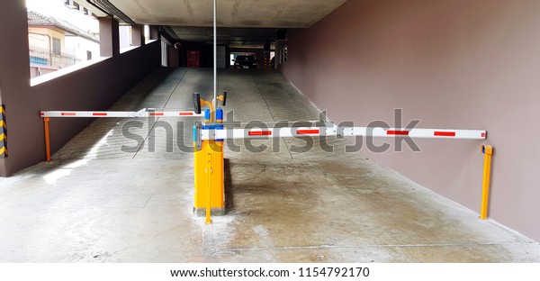 Automatic barrier gate to allow car
parking access in property building by using RFID card for identify
person - Strict, Security and Private area
concept
