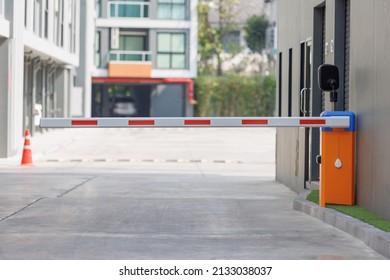 automatic barrier for home village security system. Automatic barrier arm for car park of resident. - Shutterstock ID 2133038037