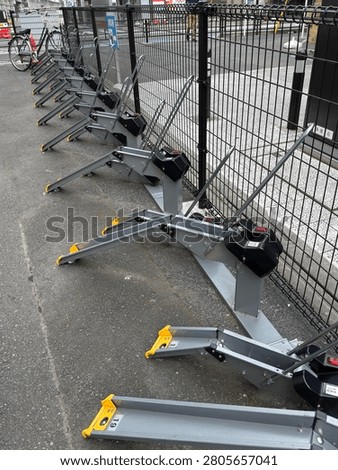 Automatic bicycle parking lock stands in a public parking facility in Japan