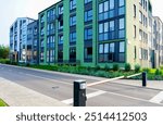 Automatic car barrier in Private urbanization residential area. Condominium complex with apartments in courtyard. Modern Apartment residential condo building. Car barrier at Entrance to courtyard area