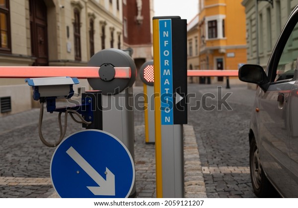 Automatic \
car barrier in residential area parking\
lot.