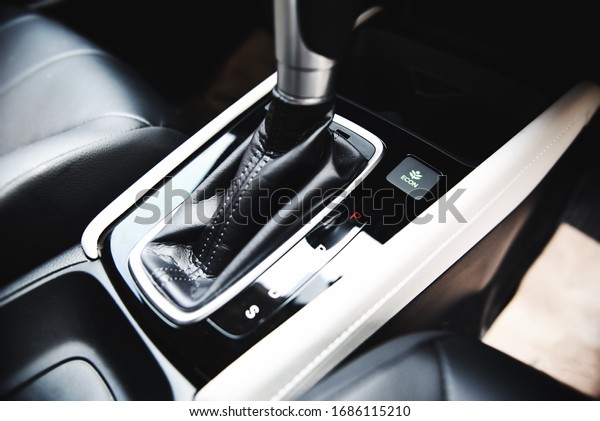 Automatic\
car transmission shift lever interior car detail / automatic gear\
and button econ mode Reducing fuel\
consumption