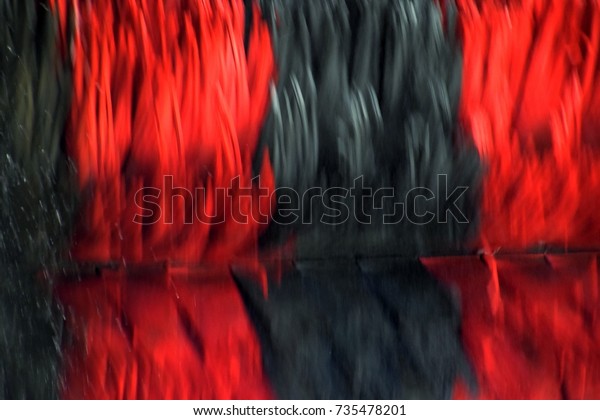 automatic car wash street, rotating\
flap System in a car wash, Abstract car wash in red and\
black
