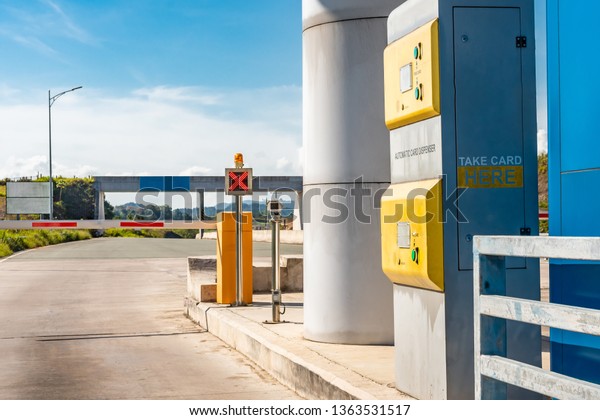 Automatic Card\
Dispenser point of entry Toll Booth for Toll Road. Red X signal\
barrier down until Card is\
taken.