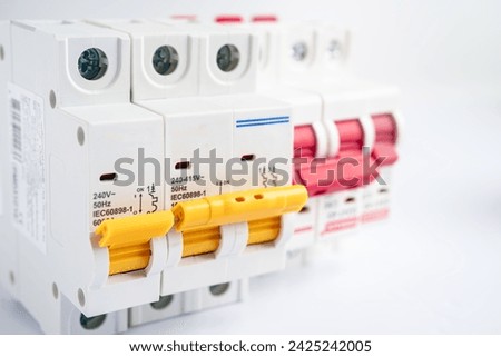 Automatic circuit breaker on white background, control and protect electrical power system.