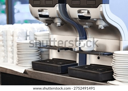 Automatic coffee machine maker with a cup