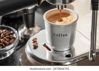 Automatic coffee machine. Pouring coffee into the coffee cup closeup.  - Powered by Shutterstock