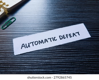 Automatic defeat writting on table background. 