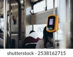 Automatic device for reading and scanning of public transport cards and bank cards to pay for riding in public transport. Validator in tram. Pay for your ride. Copy space.