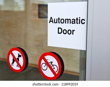 Automatic Door Sign On Shopping Mall Entrance (dogs And Bicycles Are Forbidden)