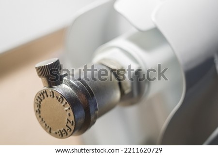 Automatic drain valve on the heating radiator in the house. Float valve for releasing excess air from the heating battery. Equipment of modern heating systems in houses. Selective focus