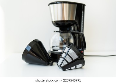 Automatic Drip Coffee Maker Isolated On White Table. Selective Focus, Noise.  Black Modern Drip Coffee Pot. Electric Kitchen Small Household Appliances. Appliances