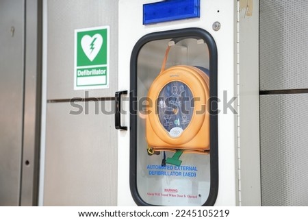 Automatic External Defibrilator (AED) device for first aid usage in a public space like train station or airport. Safety measures for public health.
