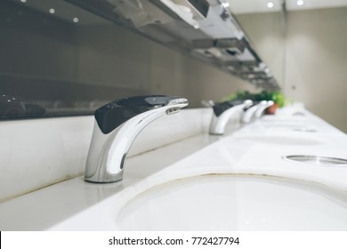 Automatic Faucet In Public Toilet