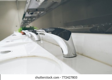 Automatic Faucet In Public Toilet