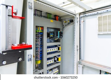 Automatic fuse electrical connector in power lines. Industrial electric enclosure, switch control panel board.