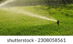 Automatic garden irrigation system watering lawn. Savings of water from sprinkler irrigation system with adjustable head. Automatic equipment for irrigation and maintenance of lawns, gardening. Banner