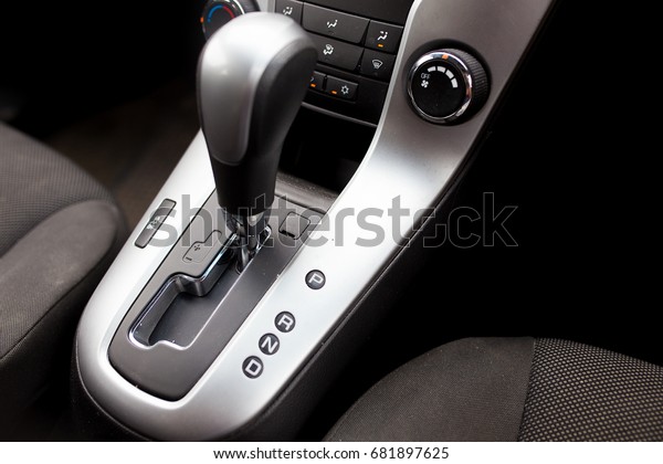 Automatic gear stick inside modern sport car.\
Luxury and expensive\
concept.