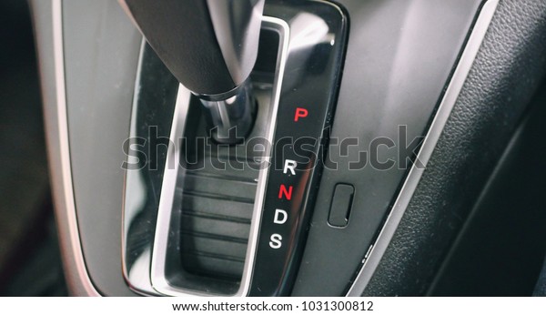 An\
automatic gear transmission shifter that can automatically change\
gear ratios as the vehicle moves. It contained the letters PRNDS\
for Park, Reverse, Neutral, Drive and Sport.\
