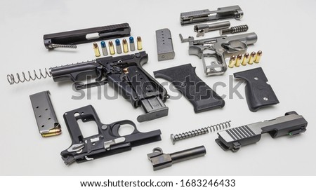 Automatic Hand guns assembly on white background