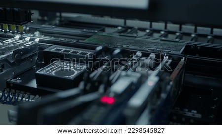 Automatic machine for assembling and installing SMD components. Industrial production of electronics and circuit board. Manufacture of electronic chips. High-tech, cthe fourth industrial revolution.