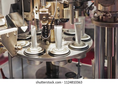 Automatic machine for filling tubes. Modern equipment for the production of cosmetics. - Shutterstock ID 1124810363
