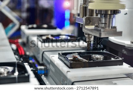 Automatic machinery for assembling and inspecting hard disk drives in the production line	