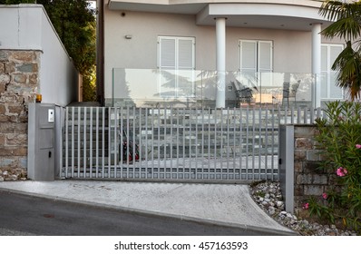 Automatic metal gates in front of the luxury holiday home.
