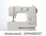 Automatic modern sewing machine with overlock on a white background, isolate. Studio concept.