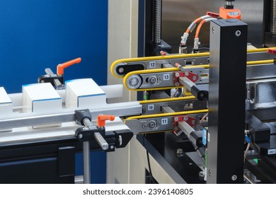 Automatic packaging conveyor line in pharmaceutical factory, pharmaceutical industrial concept background
