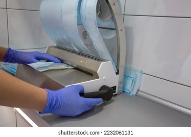 Automatic packaging of sterile instruments in the clinic or dentistry. Sterilization of instruments by a doctor's assistant, surgical instruments - Shutterstock ID 2232061131