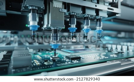 Automatic Pick and Place machine quickly installs Components on Generic Circuit Board. Electronics and Circuit board Manufacturing. Bright Environment
