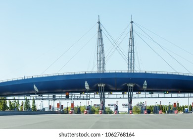 Automatic Point Of Payment For Travel On On Empty Toll Road During A Clear Sky Day