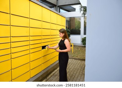 Automatic post office machine. Parcel storage room. Girl received a parcel. Yellow storage rooms
