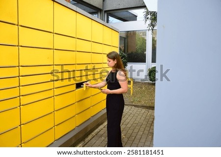 Automatic post office machine. Parcel storage room. Girl received a parcel. Yellow storage rooms