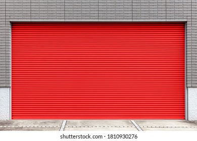 Automatic red roller shutter doors on the ground floor of the house
