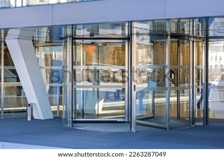 Automatic Revolving Doors at Modern Building Entrance
